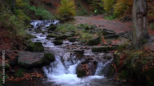 Shypit Waterfall, Carpathian Mountains, Ukraine. Hiking in the Autumn Carpathians, Water Flowing Over Rocks in an Autumn Forest