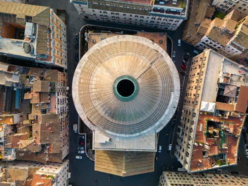 Aerial view of the Pantheon dome surrounded by historic urban buildings and narrow streets in Rome, Lazio, Italy.