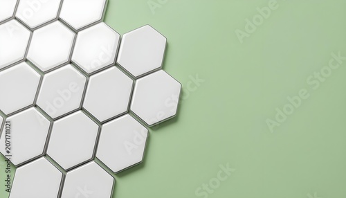 Modern hexagonal tiles arranged on a soft green background for interior design