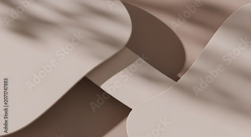 Brown and beige curved paper shapes with shadows on surface