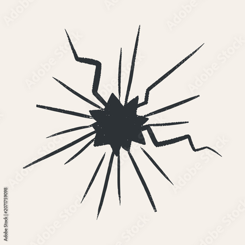 Dark grey star-shaped crack with radiating lines on a light beige background, grunge style
