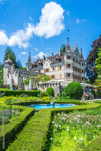 Views of Schloss Seeburg castle at Lake Constance in Kreuzlingen with gardens and clear blue sky during daytime in canton Thurgau, Switzerland