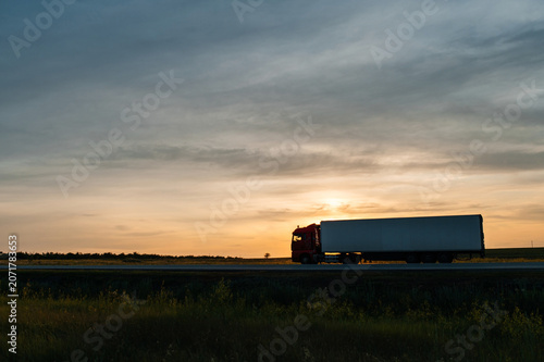 truck on the road at sunset
