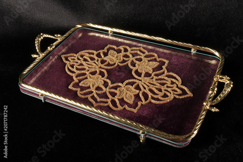 Fotografie Tray on a black background