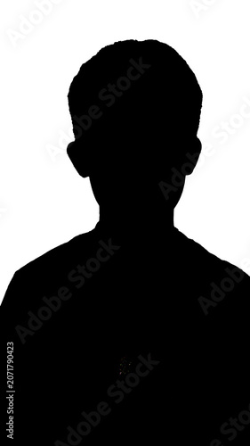 Black silhouette of a small boy standing against a white background
