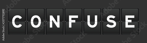 Black color analog flip board with word confuse on gray background