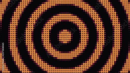 A graphic illustration displays concentric orange and black circles.