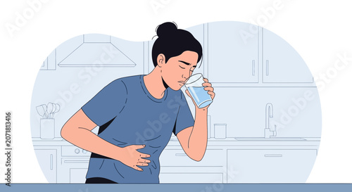 Woman Experiencing Abdominal Pain Drinks Water For Relief In Kitchen Setting