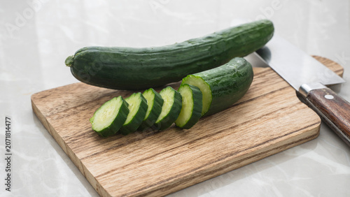 Japanese cucumbers on a cutting board. Sliced ​​cucumber