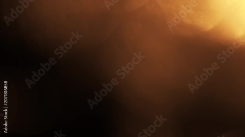 Golden bokeh light leak lens flare transition overlay with warm glow