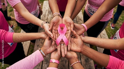 Breast cancer awareness month diverse hands united around pink ribbon symbolizing hope and support