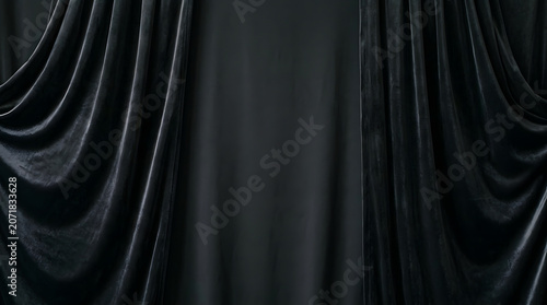Elegant black velvet curtains with deep folds and soft dramatic shadows for a luxury dark backdrop