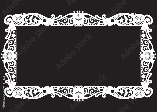 Ornate white frame with floral patterns on a black background