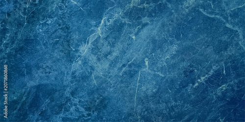Fotografía A captivating, deep blue marble texture with intricate white veining creates a sense of depth and sophistication