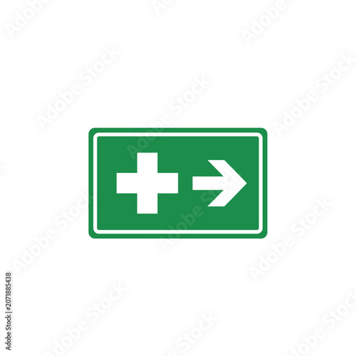 Green First Aid Sign with White Cross and Arrow.