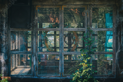 Εκτύπωση καμβά Vintage wooden window with natural greenery and rustic interior details creating a cozy atmosphere, charming garden view and nostalgic lifestyle background with warm natural light
