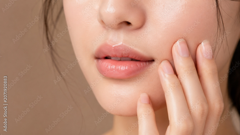 Obraz premium Beauty portrait of a woman with radiant skin and soft lips