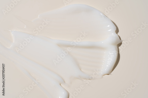 White cosmetic cream texture, skincare lotion swatch on pastel background. Face creme, body moisturiser, hair conditioner smear smudge stroke. Creamy beauty product closeup