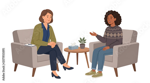 Two women sitting in chairs having a conversation with a small table and plant in between them in a therapy or counseling session setting