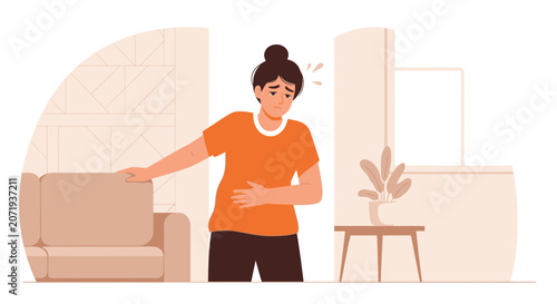 Woman Experiencing Abdominal Pain And Discomfort, Seeking Relief In Minimalist Home Setting