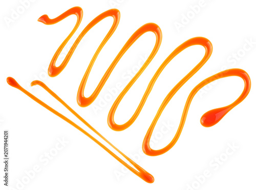 Sweet liquid caramel sauce isolated on a white background, top view. Golden butterscotch toffee caramel.