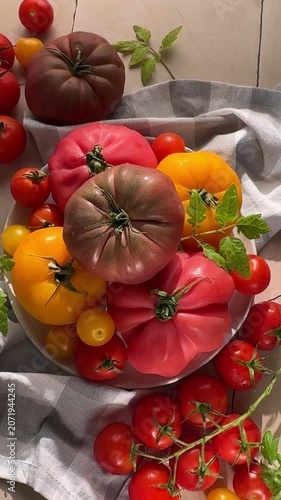 Fresh colorful heirloom tomatoes on a table