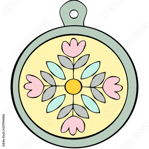 Floral Emblem: A charming circular emblem featuring a stylized floral pattern with soft pink petals, grey leaves, and light blue accents.