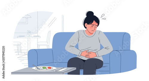 Woman Experiencing Abdominal Pain After Eating While Sitting on a Blue Couch