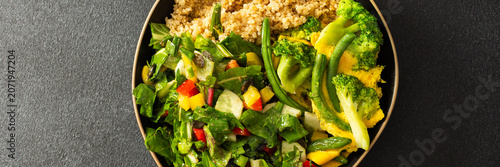 Photography This healthy breakfast consists of a quinoa bowl served with boiled eggs, green beans, and broccoli, alongside a fresh salad