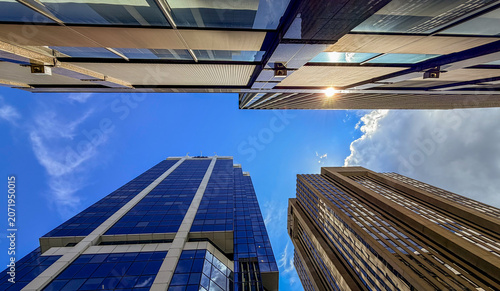 Skyscrapers reach for the sky in a busy city on a clear day