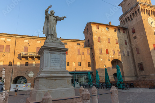Statue of Girolamo Savonarola  by Stefano Galletti in Piazza Savonarola with Este Castle in the background. Ferrara, Emilia-Romagna Italy.