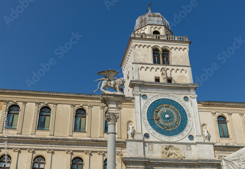 Clock tower and Lion of St. Mark in the Piazza Dei Signori, Padua, Veneto, Italy.