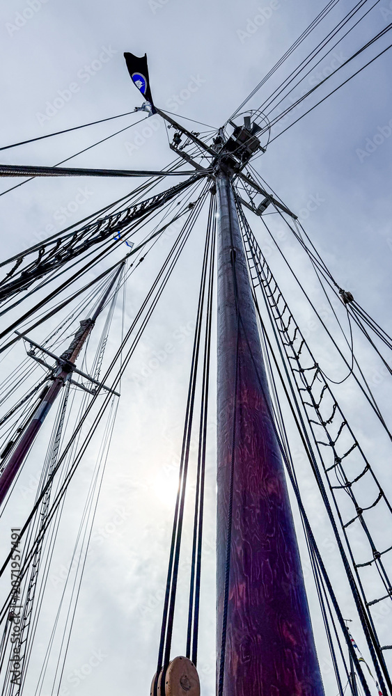 Fototapeta premium View of ship masts and rigging against the sky during the day