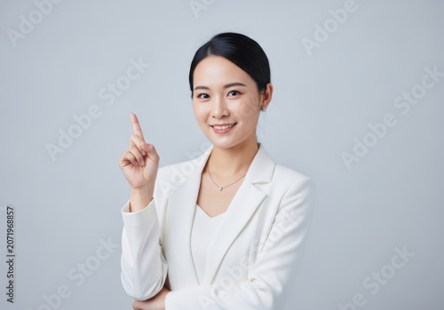 Businesswoman pointing up isolated on white background