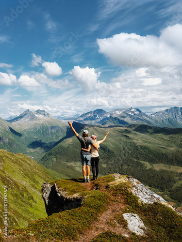 Tableau sur toile Couple in love hiking together friends travel in Norway boyfriend and girlfriend