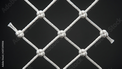 Photos Studio shot macro detail of a white goal net segment over a dark background