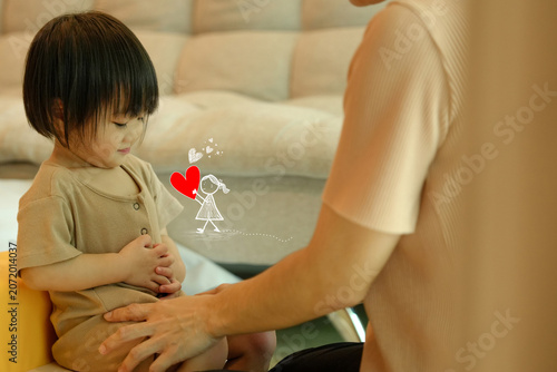 Loving Parent Caring for Toddler with Heart Doodle Symbolizing Family Love and Emotional Bond.