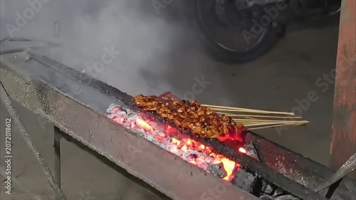Delicious Chicken Satay Grilling Over Hot Coals.