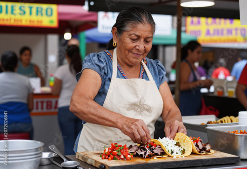 Mexican street food vendor preparing tacos al pastor