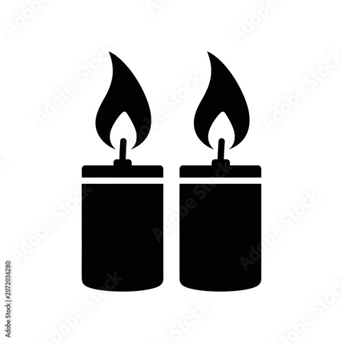 Double black candles with flames isolated on white background minimal design