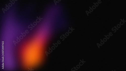 Abstract purple and orange light leak on black background, soft neon glow texture, cinematic lens flare effect for overlay