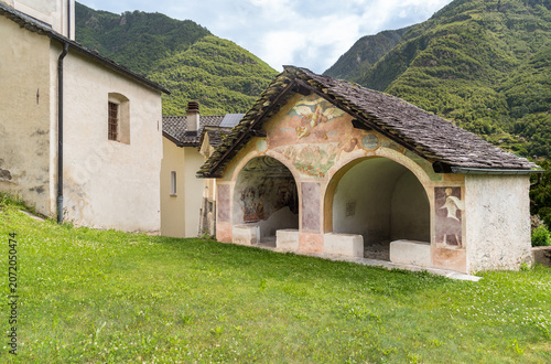 The Chapel of the Dead in Semione, located in the churchyard of the Parish Church of Santa Maria Assunta in the Blenio Valley, Canton of Ticino, Switzerland.