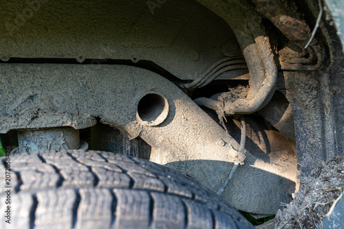 Rusty, dirty, muddy chassis on an old 4 x 4 off road vehicle close up shot.