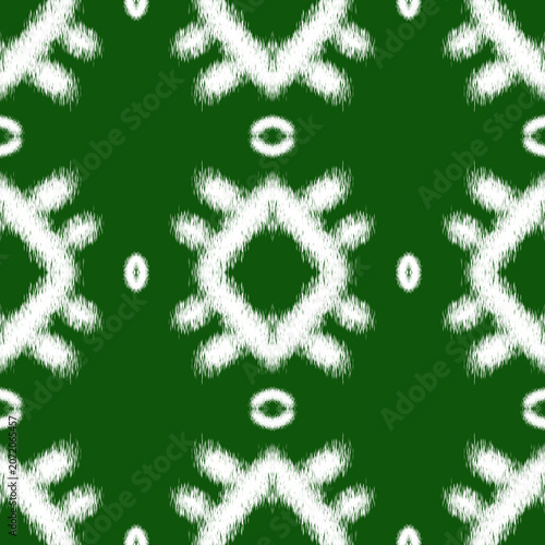 Seamless Ethnic Ikkat Pattern with White Tribal Motifs on Dark Green Background