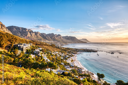 Cape Town Sunset over Camps Bay Beach with Table Mountain and Twelve Apostles in the Background