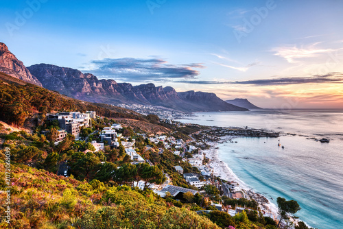 Cape Town Sunset over Camps Bay Beach with Table Mountain and Twelve Apostles in the Background
