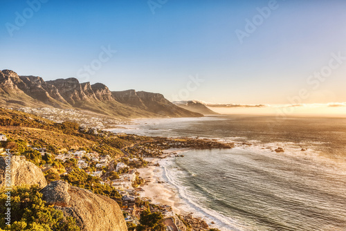 Cape Town Sunset over Camps Bay Beach with Table Mountain and Twelve Apostles in the Background