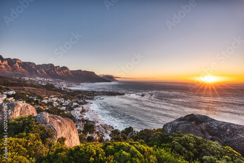 Cape Town Sunset over Camps Bay Beach with Table Mountain and Twelve Apostles in the Background