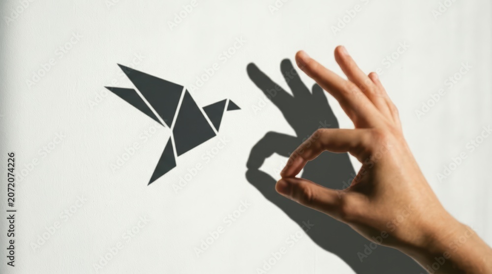 Fototapeta premium Hand casting bird shadow with index finger