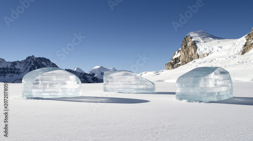Ephemeral architecture features three ice structures in snowy landscape, showcasing unique designs against mountain backdrop